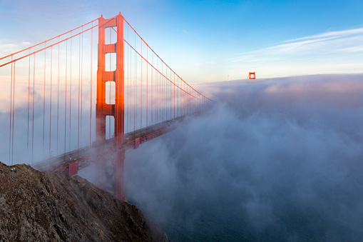 famous Golden Gate Bridge with low fog, San Francisco, USA