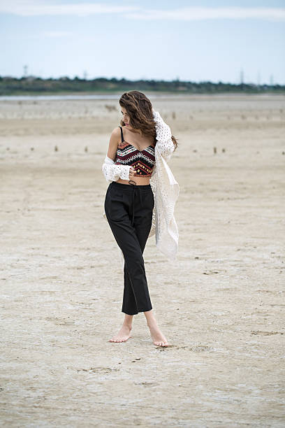 istock Girl on the sand 579421774