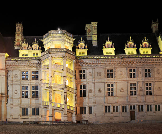 The Royal Chateau de Blois illuminated at night Blois, France- July 02, 2016: The Royal Chateau de Blois is located in the Loir-et-Cher departement in the Loire Valley, in France, in the center of the city of Blois. blois stock pictures, royalty-free photos & images
