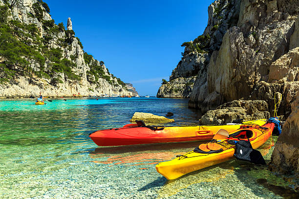 Colorful kayaks in the rocky bay,Cassis,near Marseille,France Colorful kayaks in the famous French fjords,Calanques national park,Calanque d'En Vau bay,Cassis,Marseille,southern France,Europe casis stock pictures, royalty-free photos & images