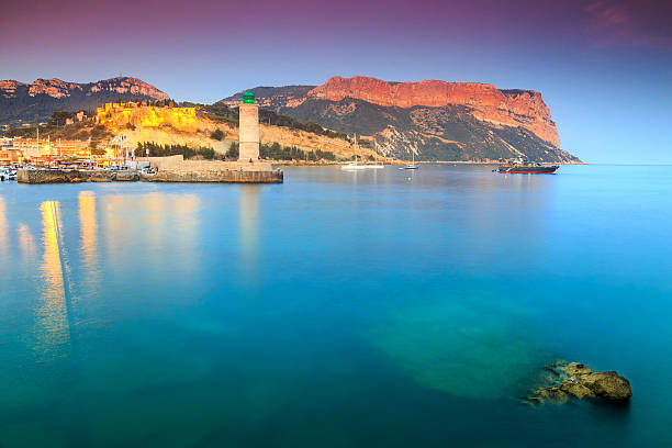 Magical sunset with Cassis harbor,lighthouse and castle in background,Marseille,France,Europe