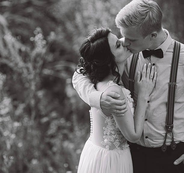 istock bride and groom kissing 579422710