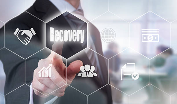 Businessman selecting a Recovery Concept button