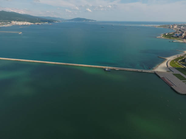 istock Top view of  bay Tsemess. Mol  building to stop  waves 579426330