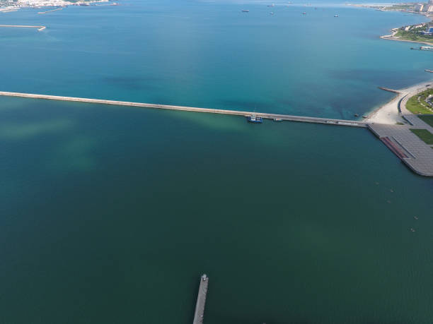 istock Top view of  bay Tsemess. Mol  building to stop  waves 579426724