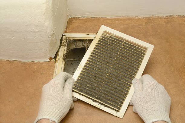istock man removes dust ventilation grilles 579427304