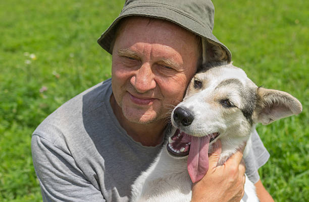 istock Mature man and his lovely young dog 579428708