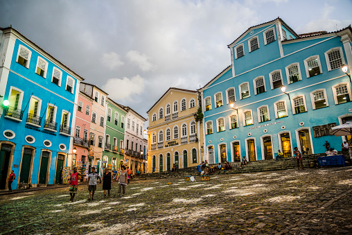 Salvador, Bahia, Brazil- September 15, 2015: Largo Pelourinho is a historic centre of the city lined with Portuguese colonial building that at dusk provide an atmospheric setting for a stroll. The blue building on the left houses museum of the famous Brazilian writer Jorge Amado.