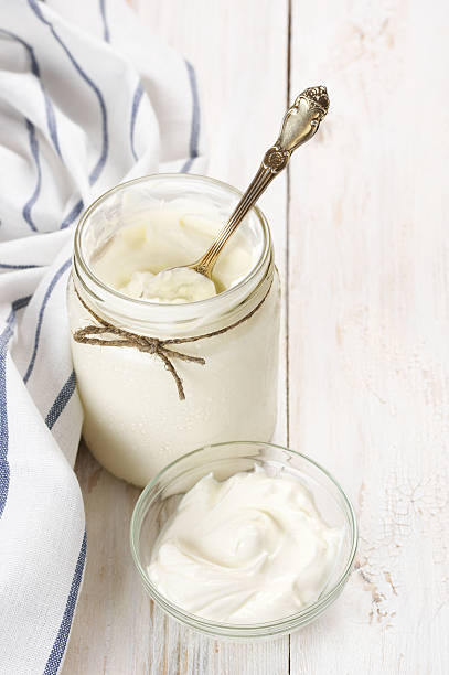 istock Sour cream in jar and bowl 579430484