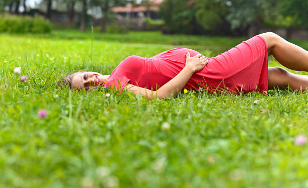 istock pregnant woman in park 579431066