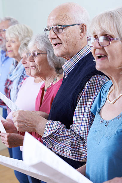 istock Group Of Seniors Singing In Choir Together 579431438