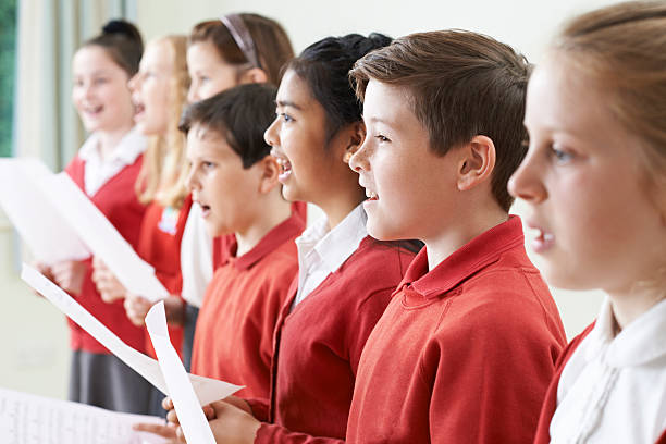 istock Group Of Children Singing In School Choir 579432570