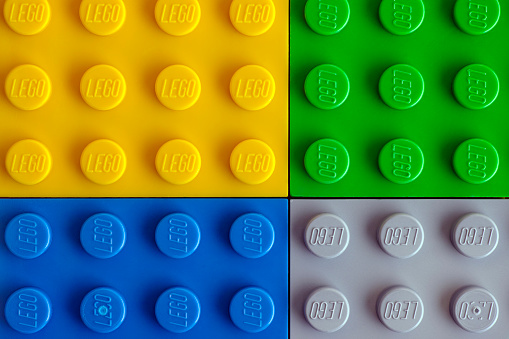 Tambov, Russian Federation - July 24, 2016: Four Lego baseplate - yellow, green, blue and gray. Studio shot.