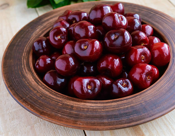 istock Ripe black cherries in a clay bowl 579434614