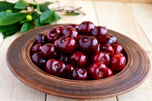 istock Ripe black cherries in a clay bowl 579434680