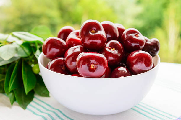 istock Ripe black cherries in a white bowl 579434838