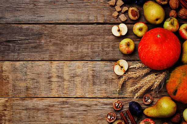 istock autumn wood dark background with pumpkin, fruit, nuts and wheat 579440550