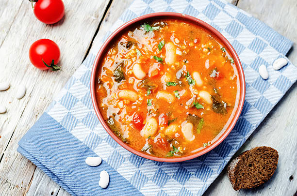 istock tomatoes spinach white beans millet soup 579441572