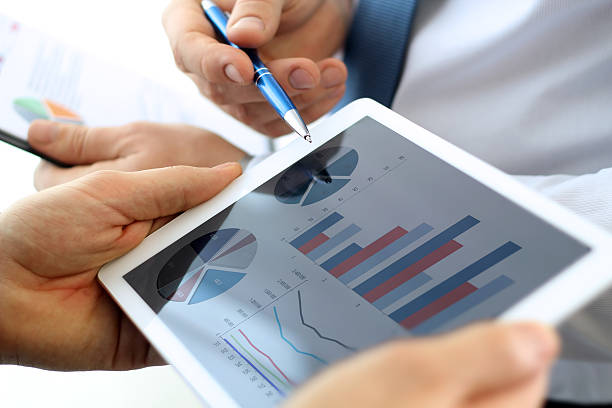 istock Business colleagues working together and analyzing financial figures 579441890
