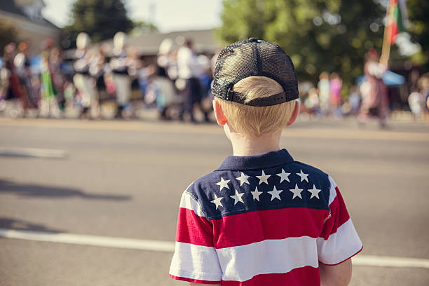 istock Kids watching an Independence Day Parade 579442624