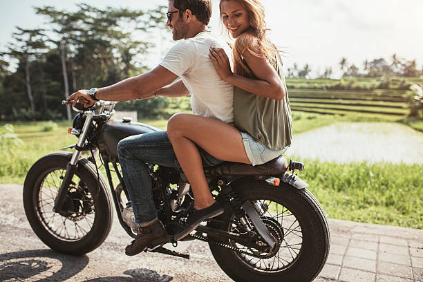 istock Young couple riding on a motorbike 579446916