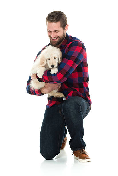 istock Cheerful man embracing his dog 579446980
