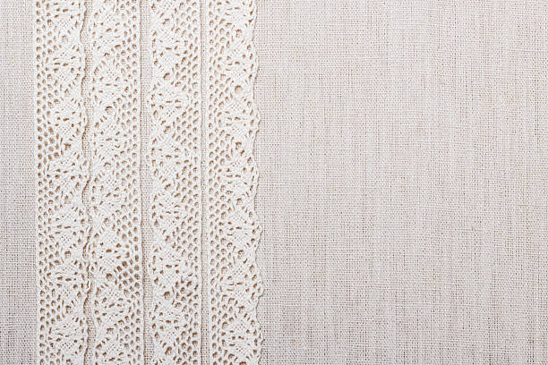 istock Lace ribbon on linen cloth background 579447556