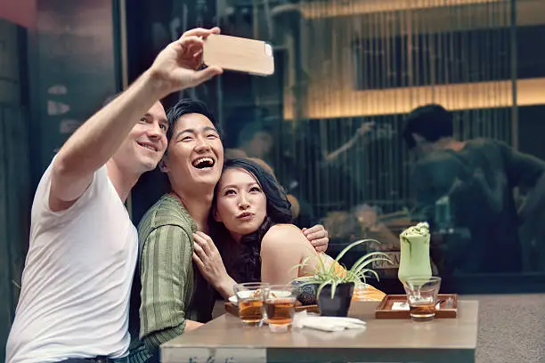 Photo of Friends in Tokyo taking selfie