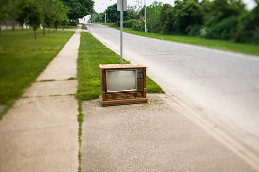 Broken television at the curb