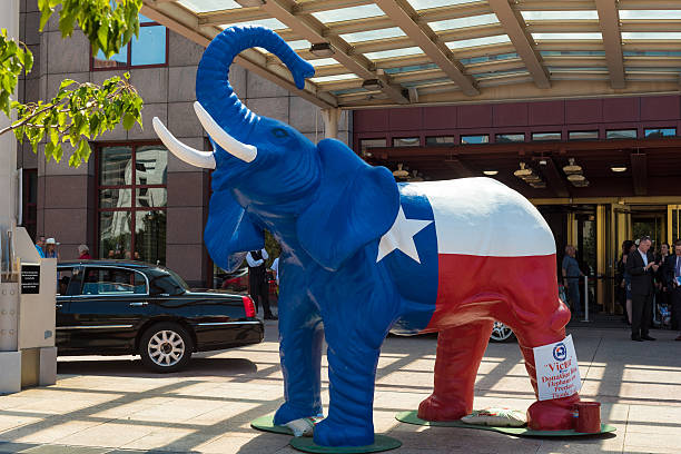 Patriotic elephant Cleveland, United States - July 20, 2016: A red-white-and-blue elephant stands in front of the downtown Marriott Hotel with a donation bucket during the Republican National Convention. rnc stock pictures, royalty-free photos & images