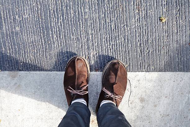 istock Top view of man legs in black jeans 579734980