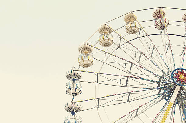istock ferris wheel against blue sky 579735104