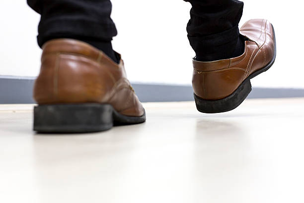 istock Half leg of man Walking in the office 579735358