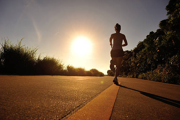 istock young woman runner running on sunrise seaside 579736418