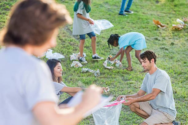 istock Group of people clean up garbage in their community 579736502