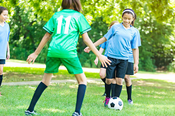 istock Two middle school girl soccer teams practicing together 579736864