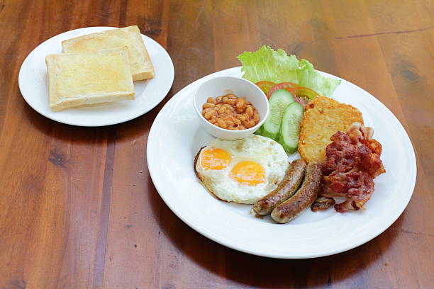 istock plate with boiled rice egg and sausage, fry shrimp, bacon 579736948