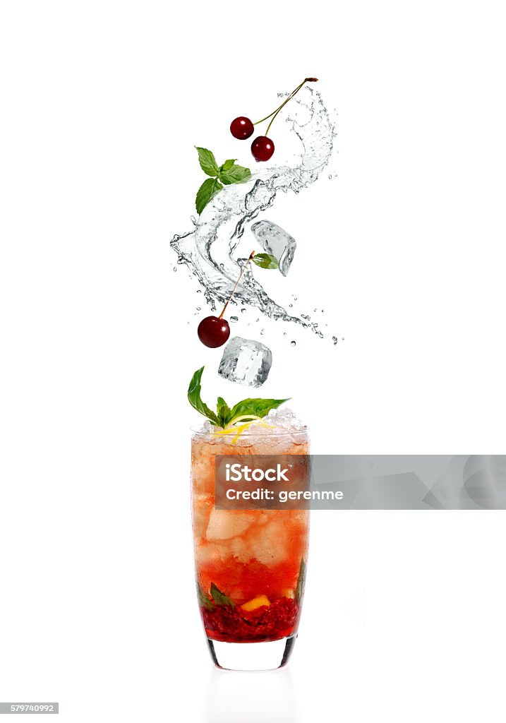 Cocktail splash cocktail with cherries and splashes Splashing Stock Photo