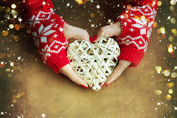 istock Christmas heart  in woman hands 579742408