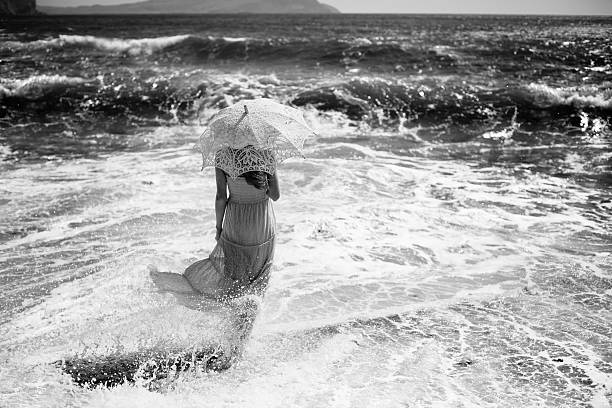 istock Beautiful young woman on the beach. Ocean 579743534