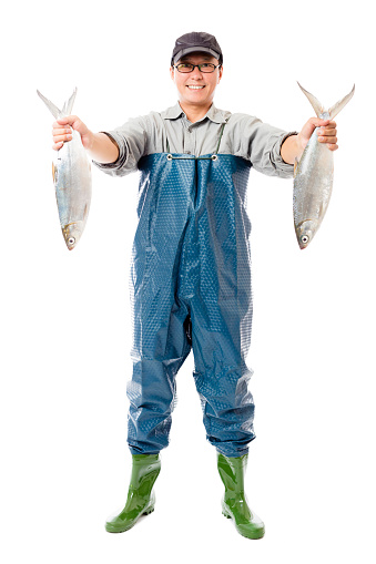 happy fisherman showing big fish isolated on white