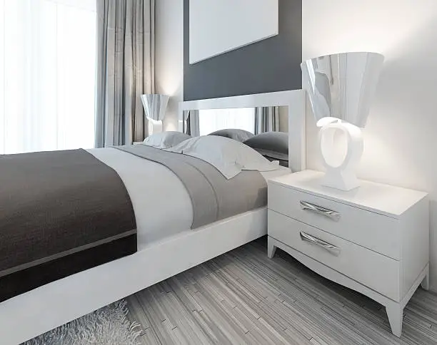 Modern white nightstand with a lamp by the bed in a bedroom Contemporary style. 3D render.