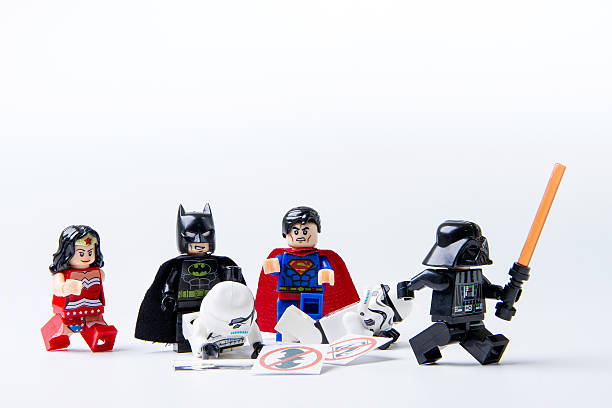 lego batman and superman expel lego stormtrooper and darth vader - superman imagens e fotografias de stock