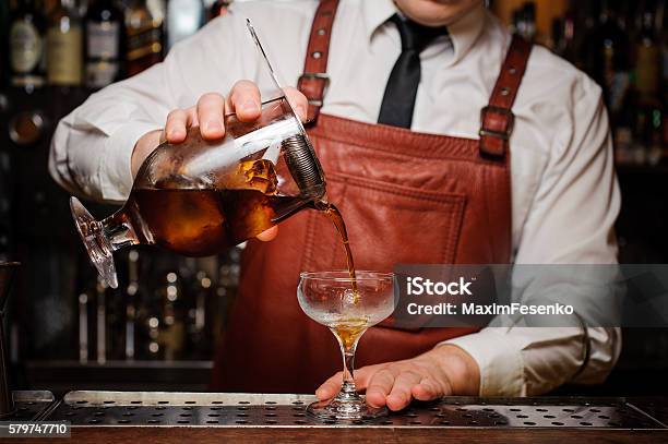 Bartender Pouring Fresh Cocktail In Fancy Glass Stock Photo - Download Image Now - Bartender, Cocktail, Pouring