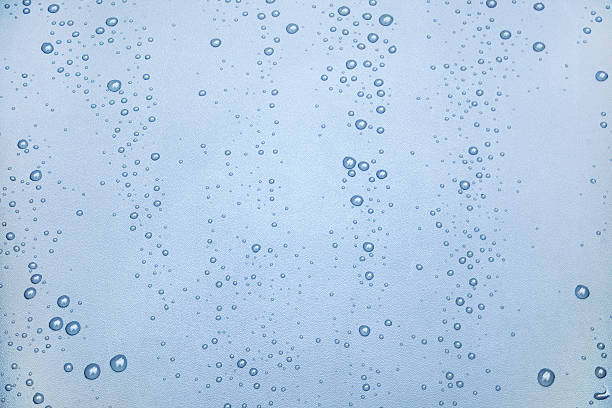 istock Rows of raindrops on wrinkled surface. 579748180