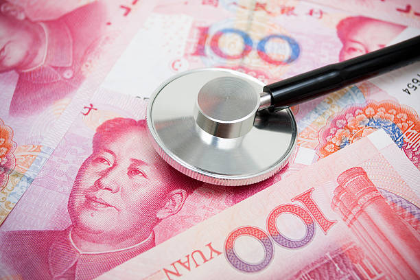 istock Stetroscope on Chinese Yuan Note Currency 579749044