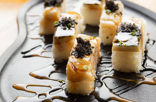 istock Grilled mackerel or saba sushi with black fish roe 579752104