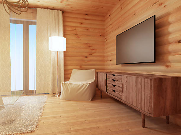 istock Wood TV console with a comfortable white armchair 579754032