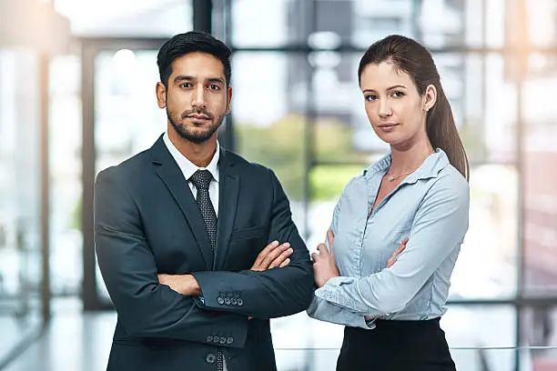 Shot of two businesspeople standing side by side