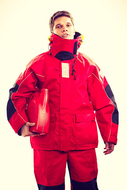 istock Man in oilskin with bottle. 579755118